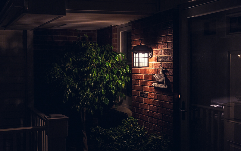 dark brick porch with light from decorative porch light