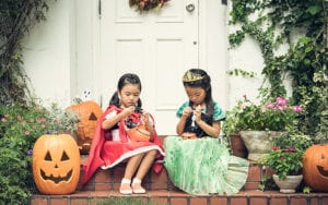 Kids looking at candy on Halloween