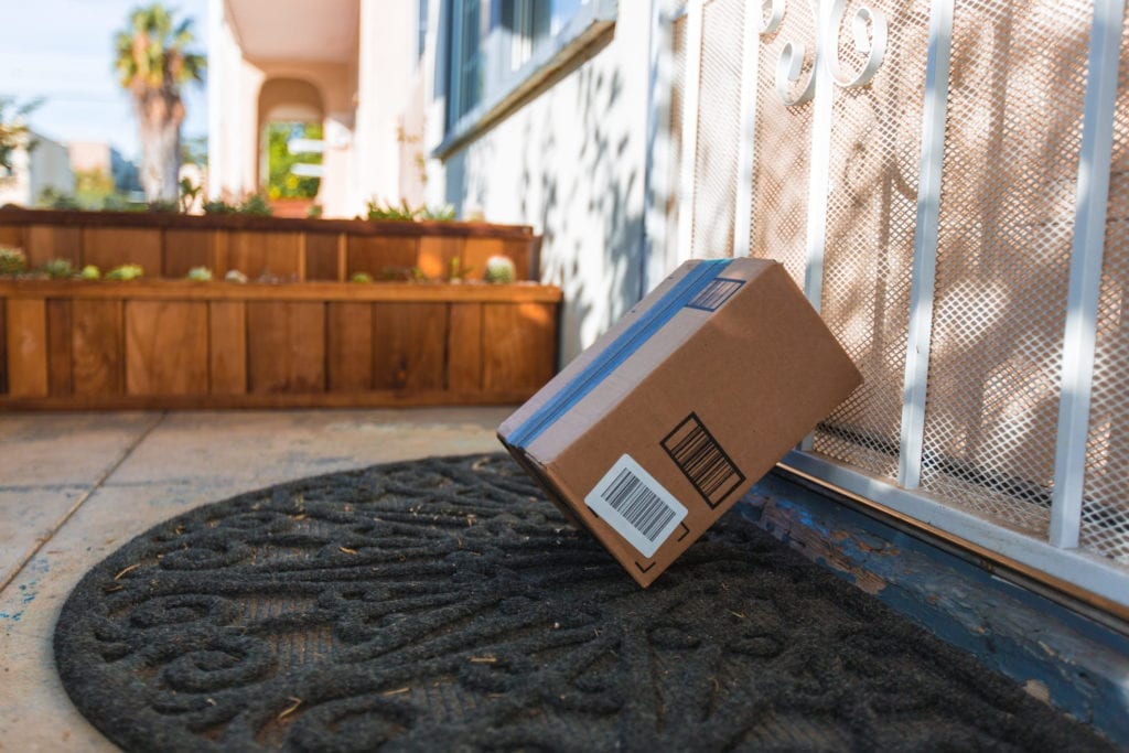 cardboard package delivery at front door