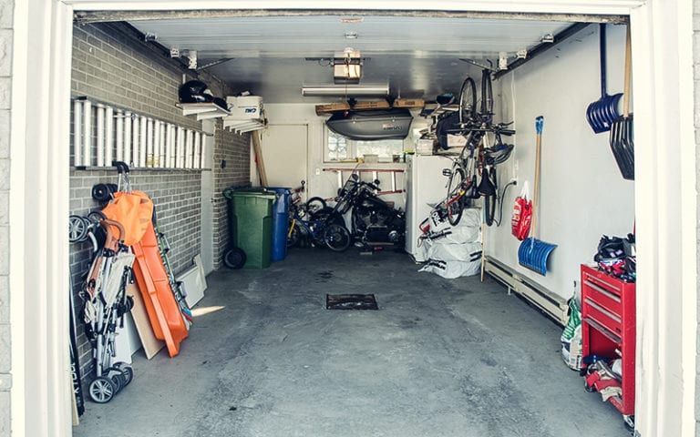 open garage with bikes and storage